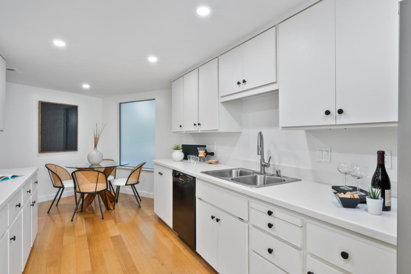 300 Sand Hill Circle, Unit 101 Menlo Park, CA 94025 - Photo 12 of 47 a kitchen with granite countertop white cabinets and white appliances