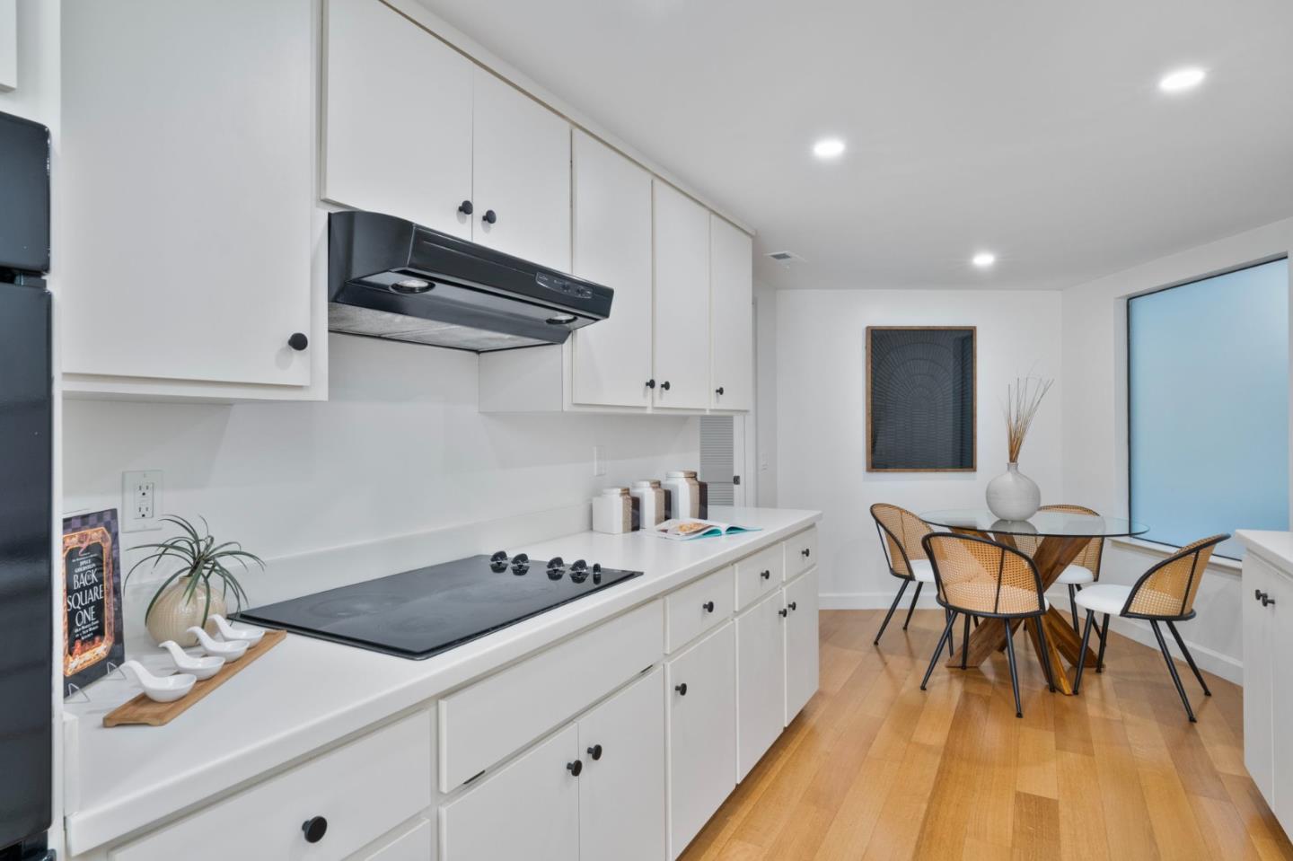 300 Sand Hill Circle, Unit 101 Menlo Park, CA 94025 - Photo 13 of 47 a kitchen with stainless steel appliances granite countertop a sink dishwasher and cabinets with wooden floor