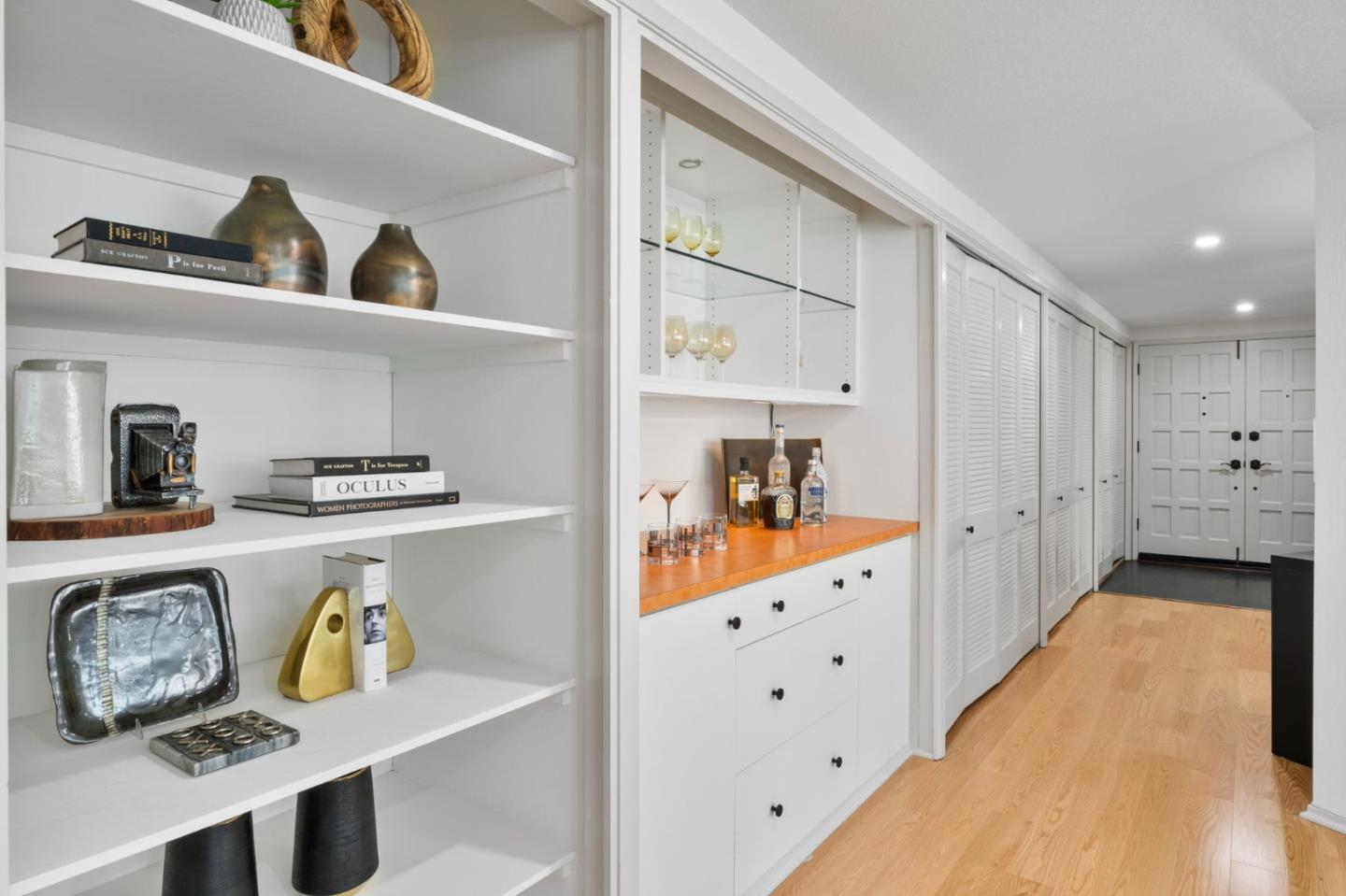 300 Sand Hill Circle, Unit 101 Menlo Park, CA 94025 - Photo 20 of 47 a kitchen with white cabinets and wooden floor