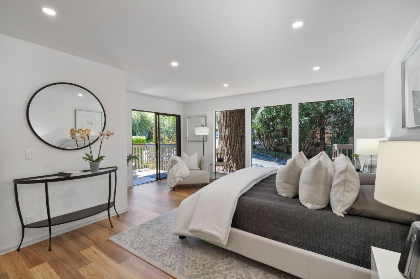 300 Sand Hill Circle, Unit 101 Menlo Park, CA 94025 - Photo 22 of 47 a bedroom with a large bed and a large window