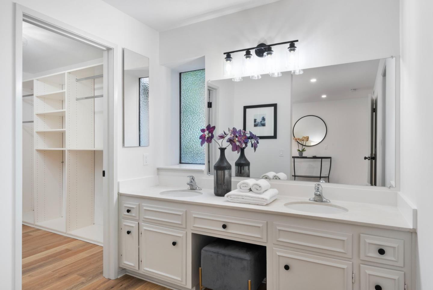 300 Sand Hill Circle, Unit 101 Menlo Park, CA 94025 - Photo 28 of 47 a bathroom with a double vanity sink and a mirror
