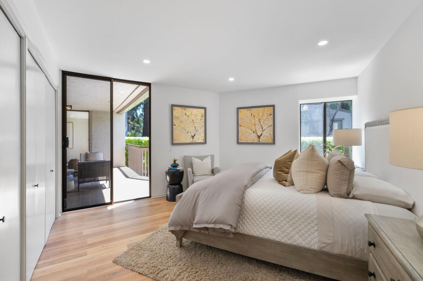 300 Sand Hill Circle, Unit 101 Menlo Park, CA 94025 - Photo 31 of 47 a bedroom with a large bed and a couch