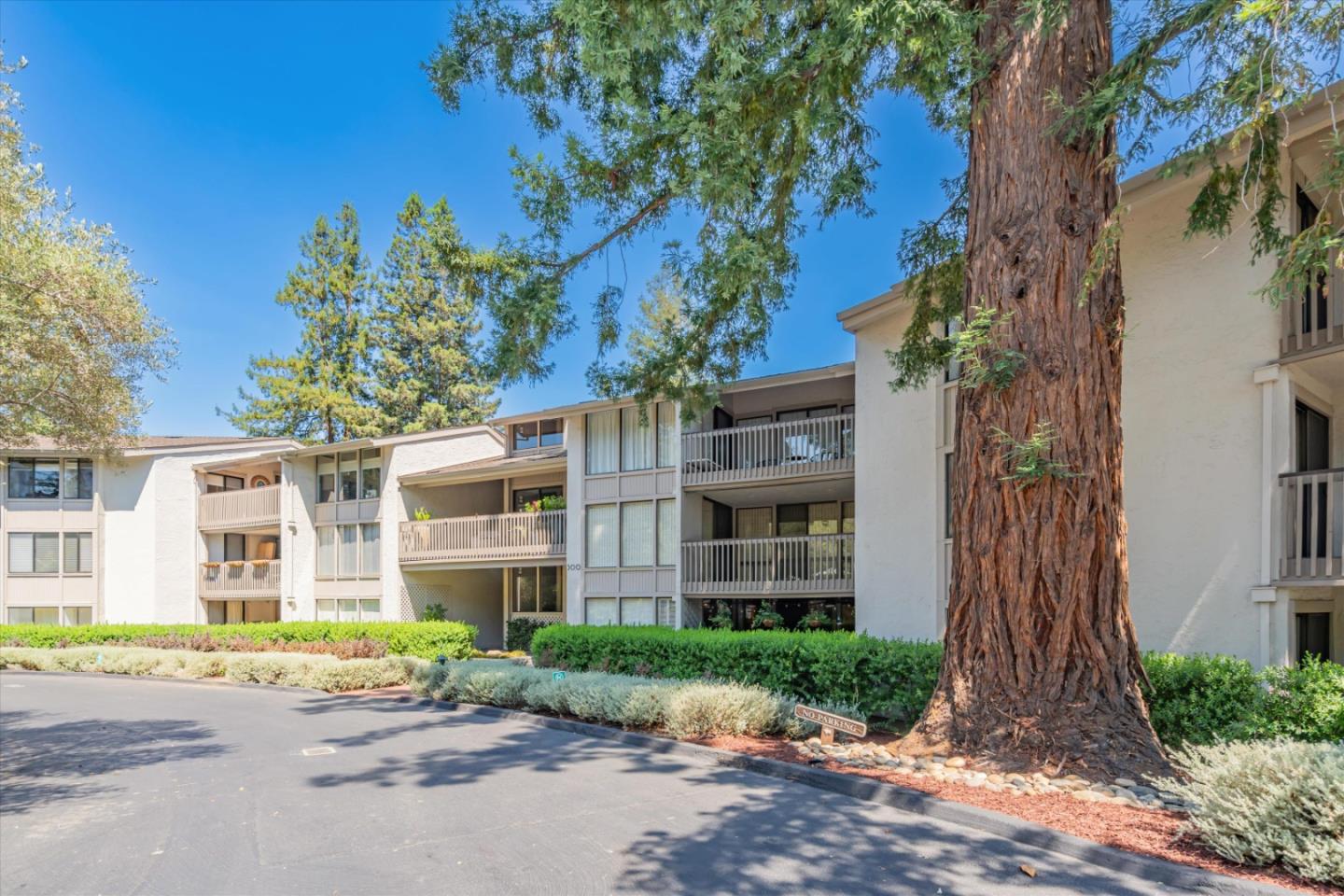 300 Sand Hill Circle, Unit 101 Menlo Park, CA 94025 - Photo 40 of 47 a brick building with a tree in front of it