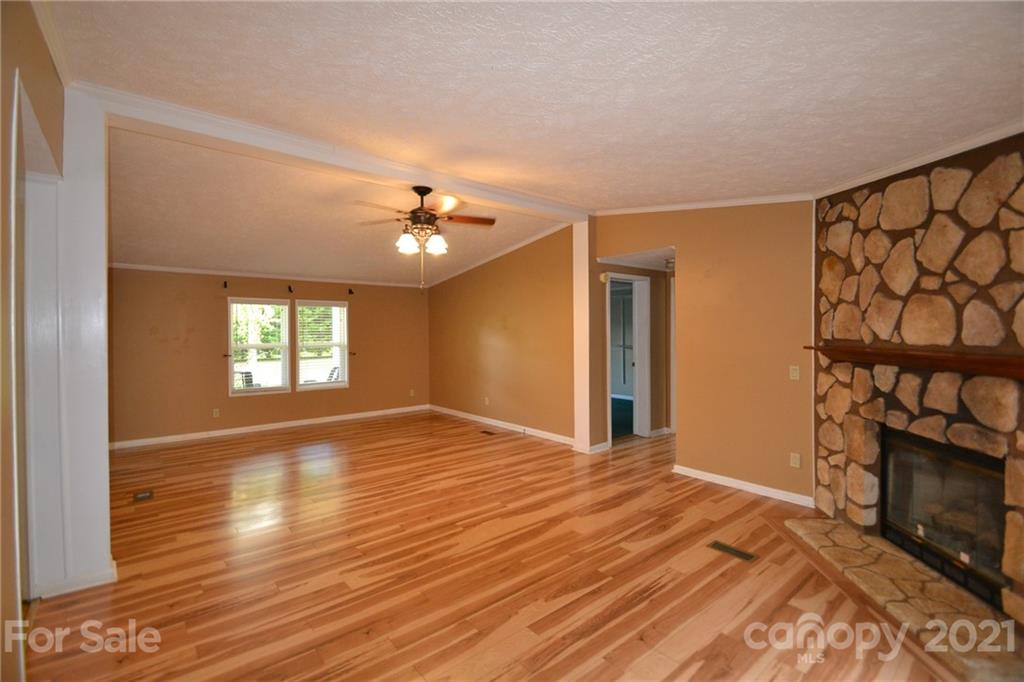 3511 Thunder Road Maiden, NC 28650 - Photo 12 of 44 a view of an empty room with window and wooden floor