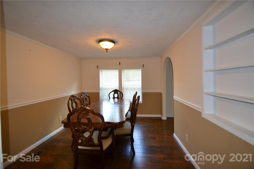 3511 Thunder Road Maiden, NC 28650 - Photo 14 of 44 a view of a dining room with furniture and wooden floor
