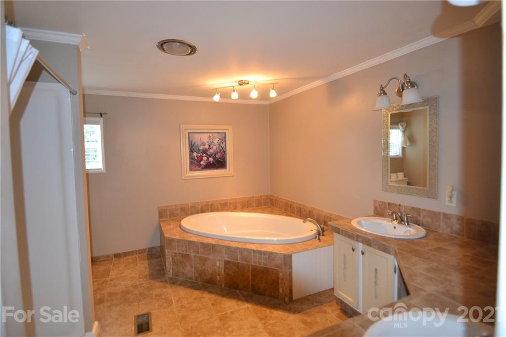 3511 Thunder Road Maiden, NC 28650 - Photo 24 of 44 a bathroom with a sink a toilet and shower