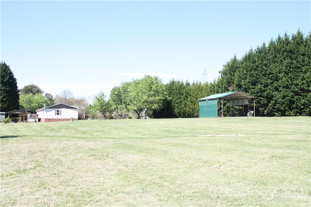 3511 Thunder Road Maiden, NC 28650 - Photo 36 of 44 a view of a yard with an outdoor space