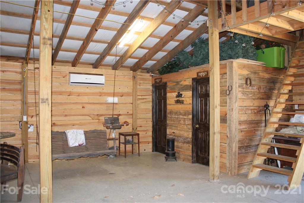 3511 Thunder Road Maiden, NC 28650 - Photo 6 of 44 a view of a patio with table and chairs and wooden fence