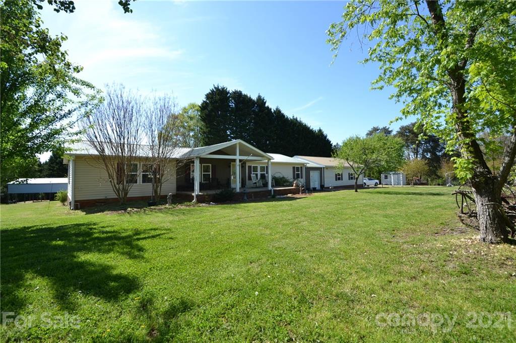3511 Thunder Road Maiden, NC 28650 - Photo 9 of 44 a aerial view of a house with swimming pool next to a big yard