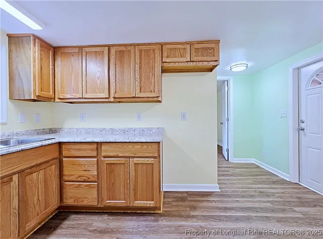 a view of cabinets and wooden floor