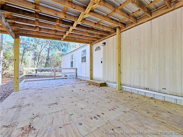 a view of garage with wooden floor
