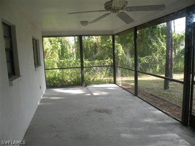 18213 Maple Road Fort Myers, FL 33967 - Photo 5 of 9 a view of porch with a floor to ceiling window