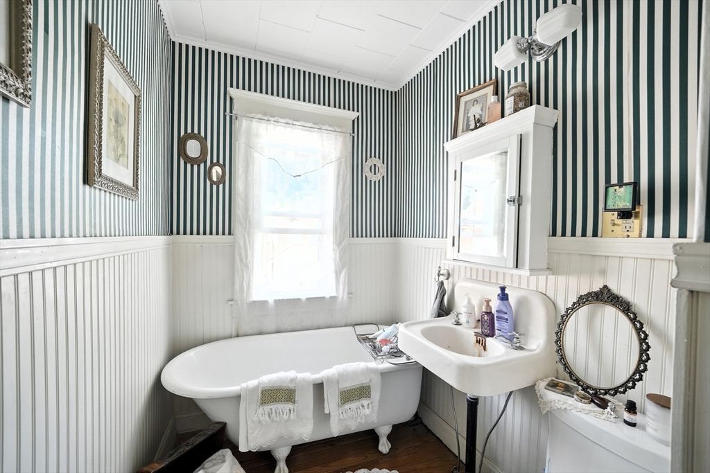96 Firglade Avenue Springfield, MA 01108 - Photo 14 of 31 a bathroom with a sink mirror and a window