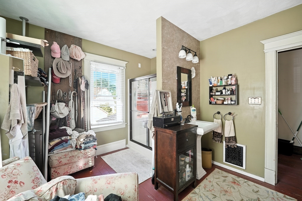 96 Firglade Avenue Springfield, MA 01108 - Photo 15 of 31 a living room with furniture mirror and a table