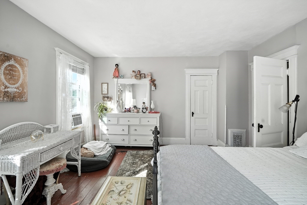 96 Firglade Avenue Springfield, MA 01108 - Photo 22 of 31 a bedroom with a bed and a dresser