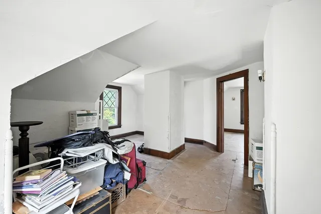 a room with gym equipment and a table