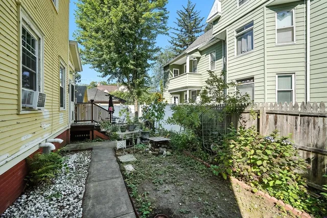 a view of a back yard of the house