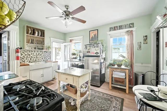 a kitchen with a table and chairs