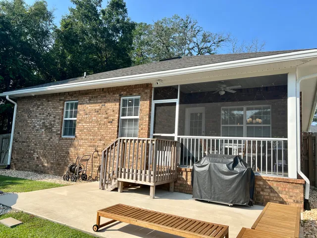 a roof deck with a chair and table