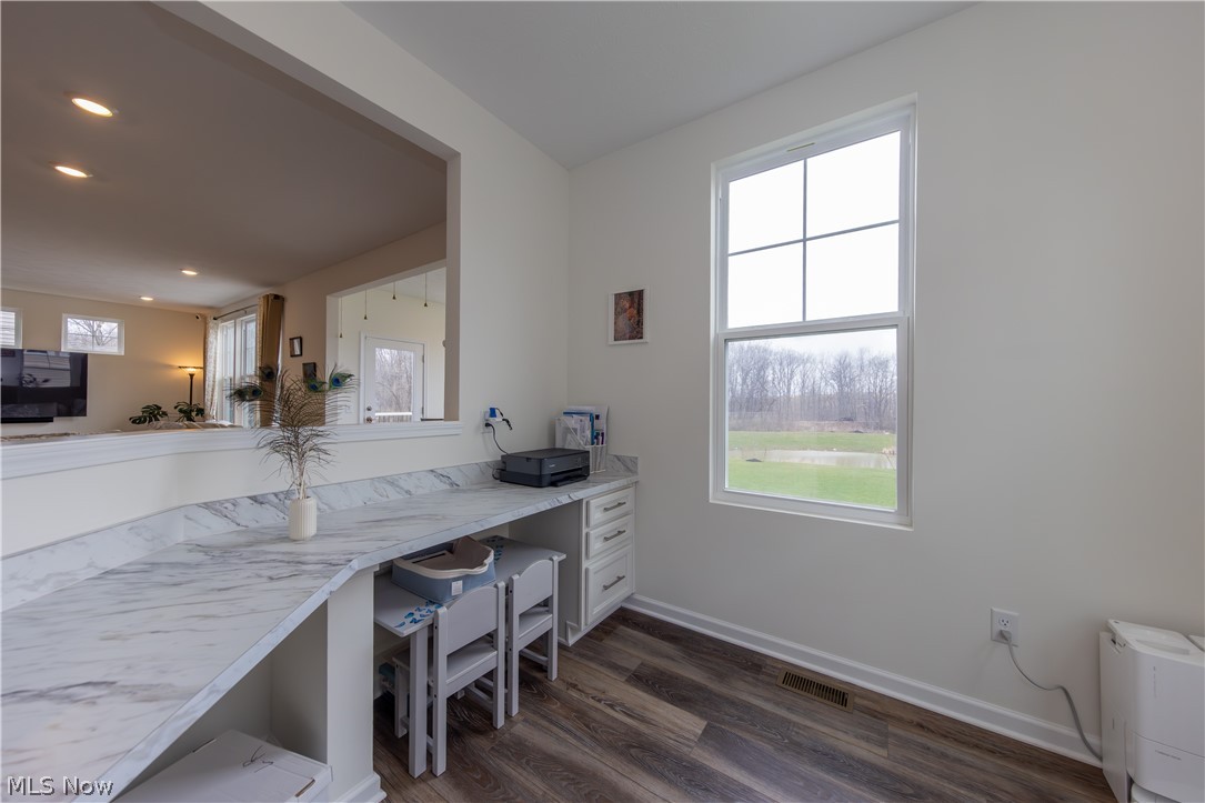 766 River Run Road Aurora, OH 44202 - Photo 22 of 49 Office/study/kitchen prep area with light countertops, dark wood finished floors, an office area, and recessed lighting