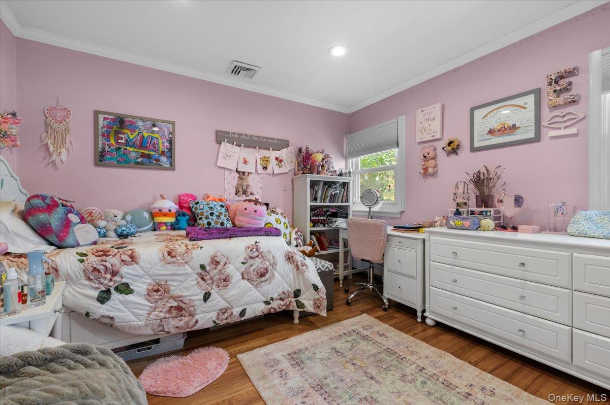 61 Winthrop Road Plainview, NY 11803 - Photo 22 of 37 a bed room with a bed and a bed