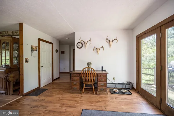 a view of a livingroom with furniture window and wooden floor