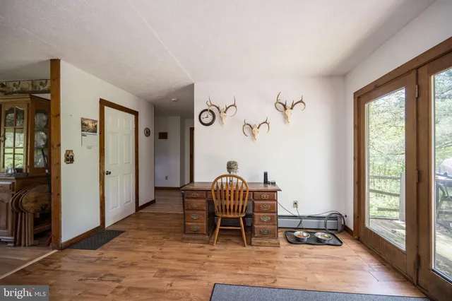 a view of a livingroom with furniture window and wooden floor