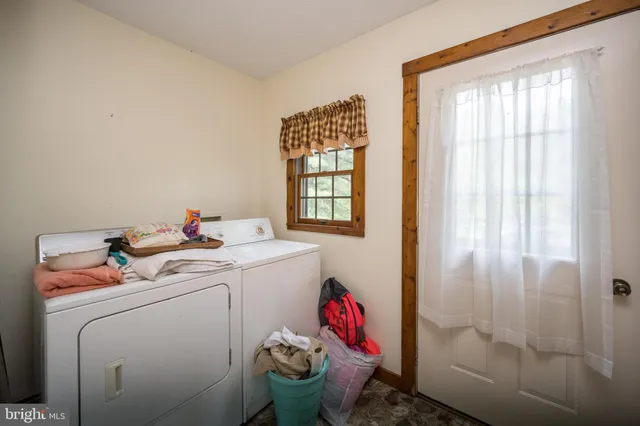 a view of a dining room with furniture and window