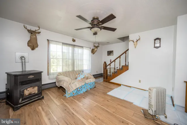 a spacious bedroom with a bed and a chandelier