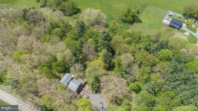 a kitchen with stainless steel appliances a refrigerator sink and cabinets