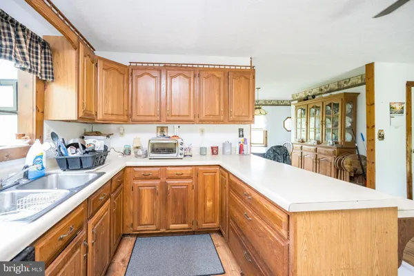 a kitchen with a refrigerator stove and sink