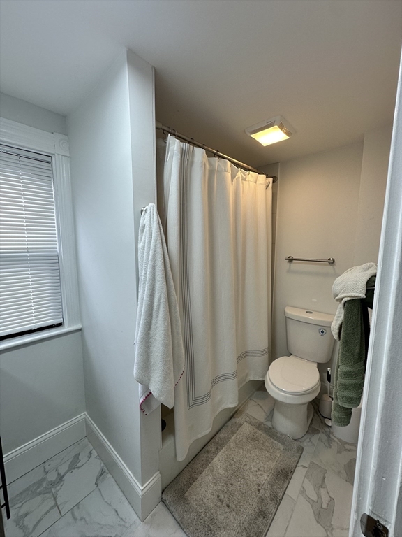 175 Everett Street, Unit 1 Boston, MA 02134 - Photo 24 of 25 a bathroom with a sink toilet and shower