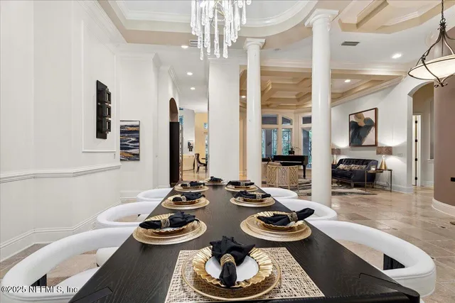 a view of a swimming pool with outdoor seating