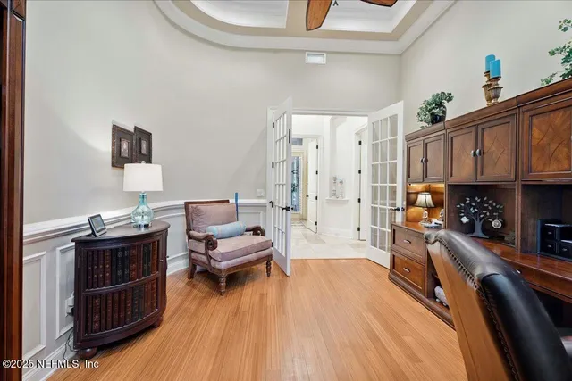 an aerial view of residential houses with outdoor space and trees