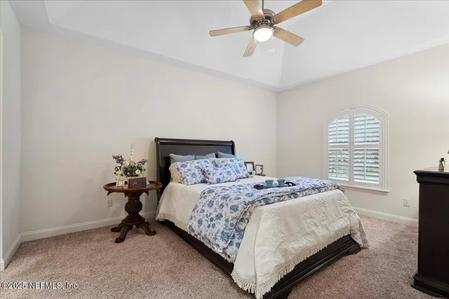 an aerial view of a house with a swimming pool