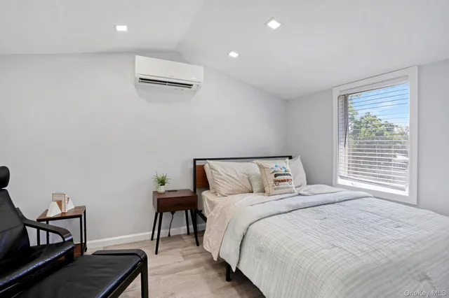 a bedroom with a bed and a chair