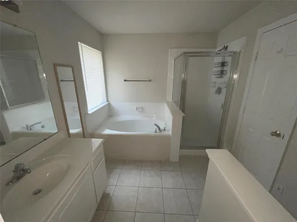 a bathroom with a bathtub sink and toilet