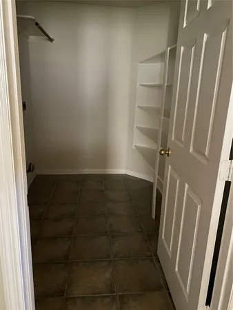 a bathroom with a glass door shower