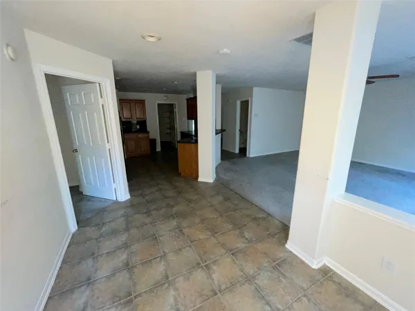 wooden floor in a hall with an entryway