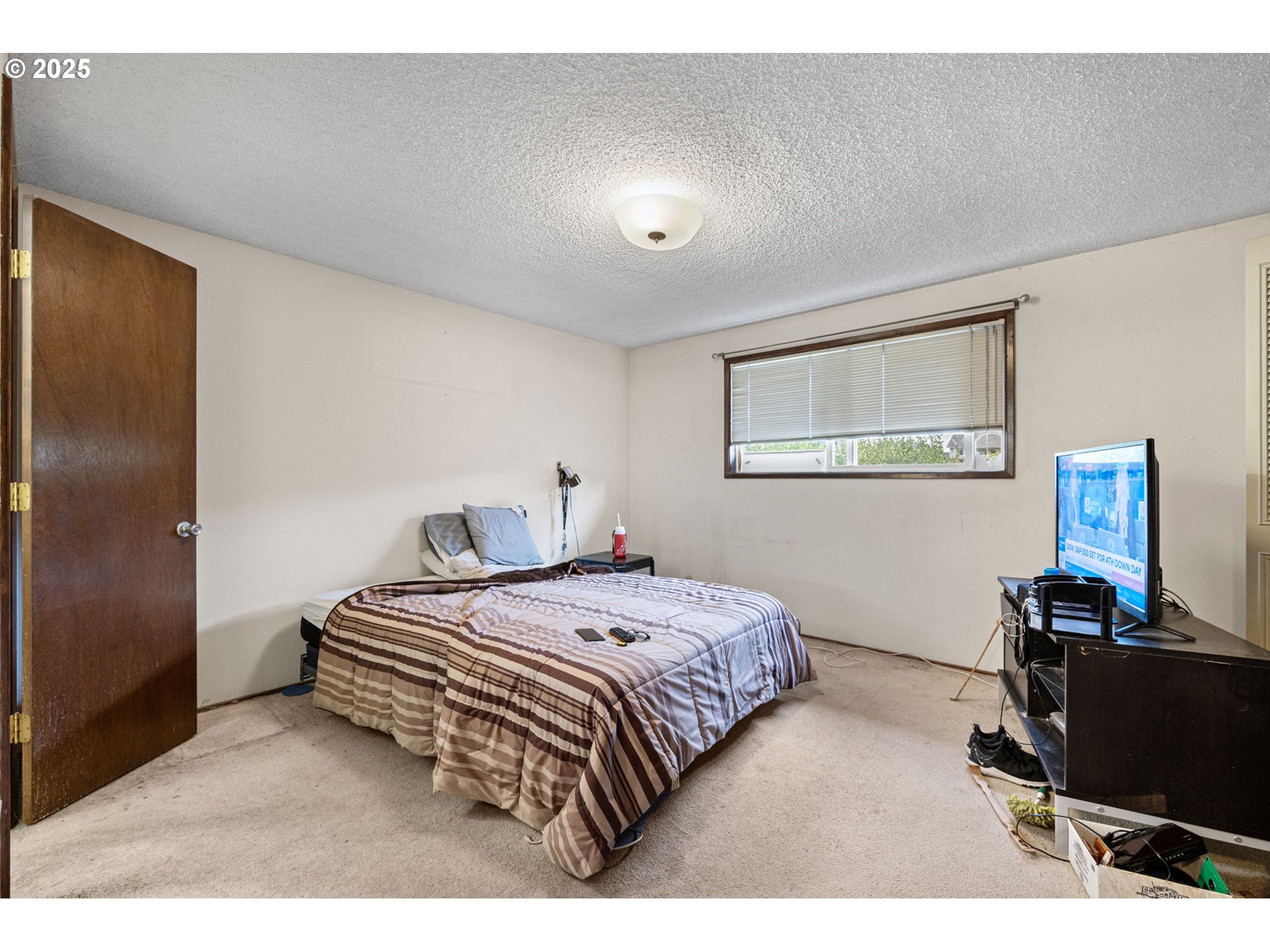 1429 Delrose Avenue Springfield, OR 97477 - Photo 10 of 21 a bedroom with a bed and a computer on a desk next to a window