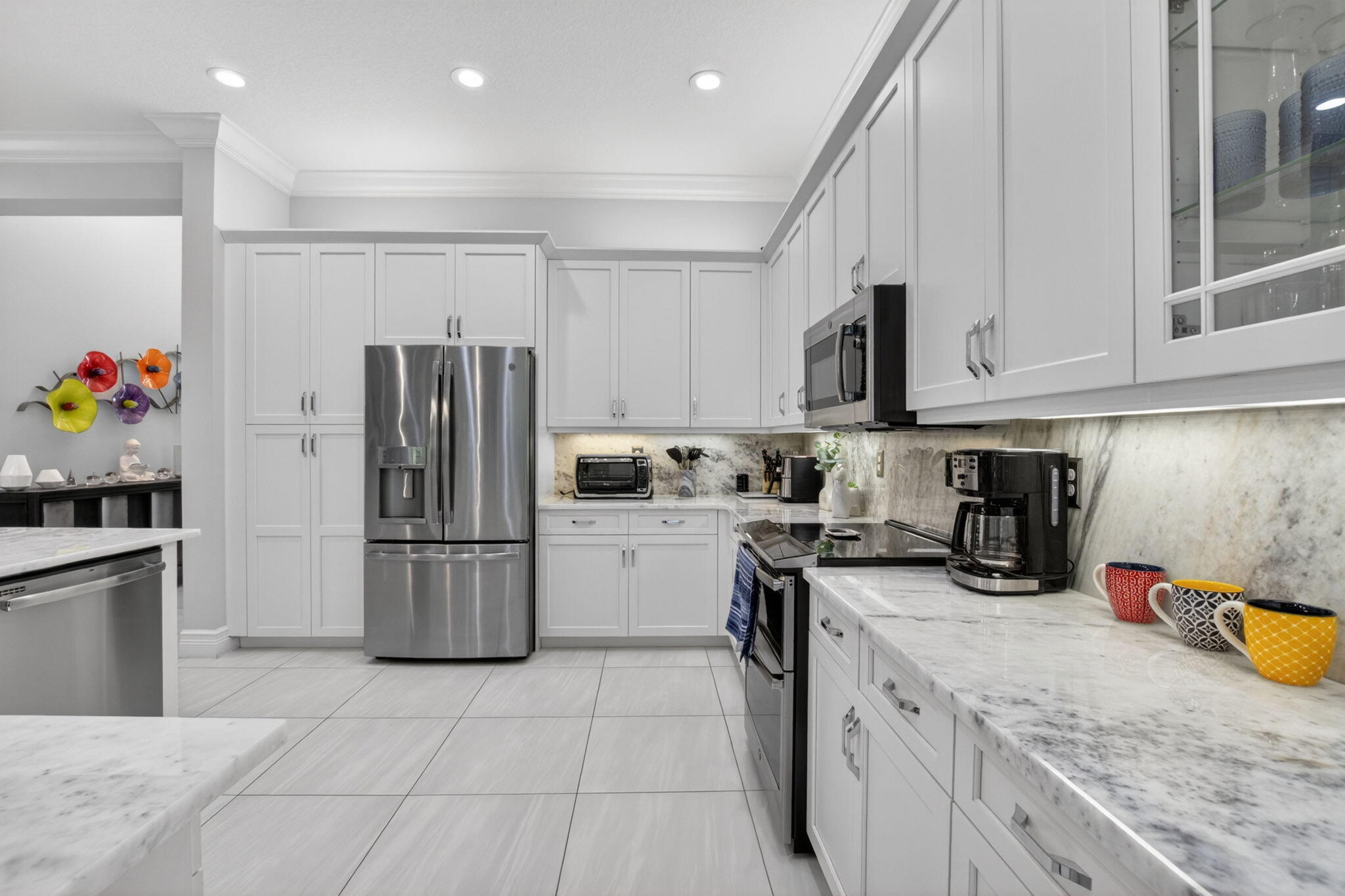 8263 Arabian Range Road Boynton Beach, FL 33473 - Photo 21 of 52 a kitchen with a refrigerator a stove and a sink