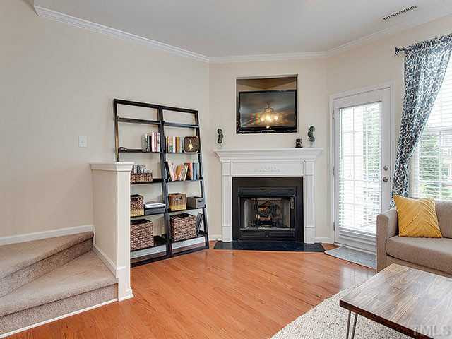 133 Cedar Elm Road Durham, NC 27713 - Photo 10 of 20 Cozy up by the fire on cold nights or open up the door and window on perfect spring days. Staircase perfectly situated and out of the way! Living Room