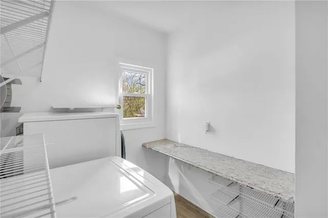 a bathroom with a bathtub and a window