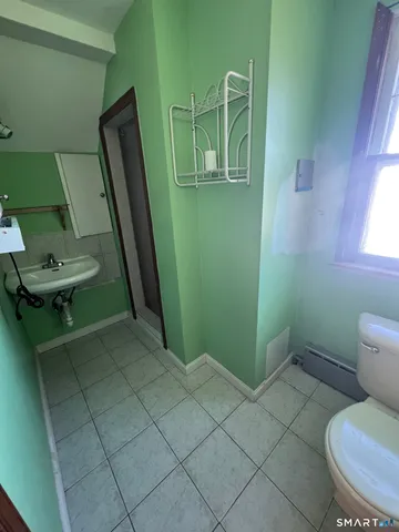 a bathroom with a toilet and a sink