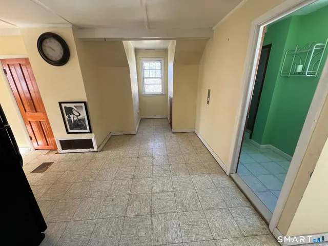 a view of a hallway and front door