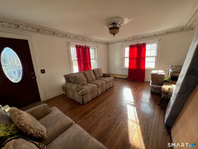 a living room with furniture and a window