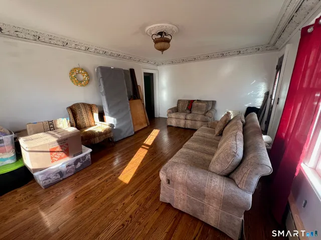a living room with furniture and a table