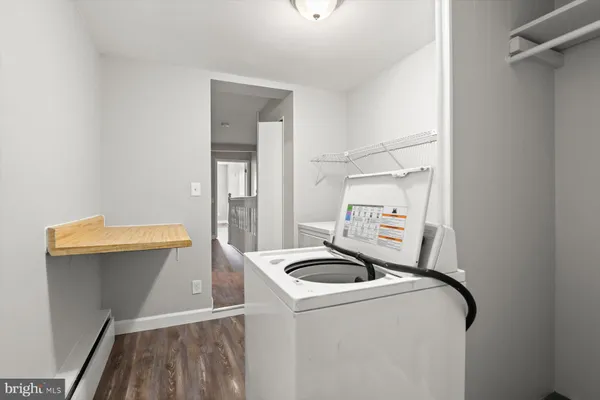 a utility room with dryer and washer
