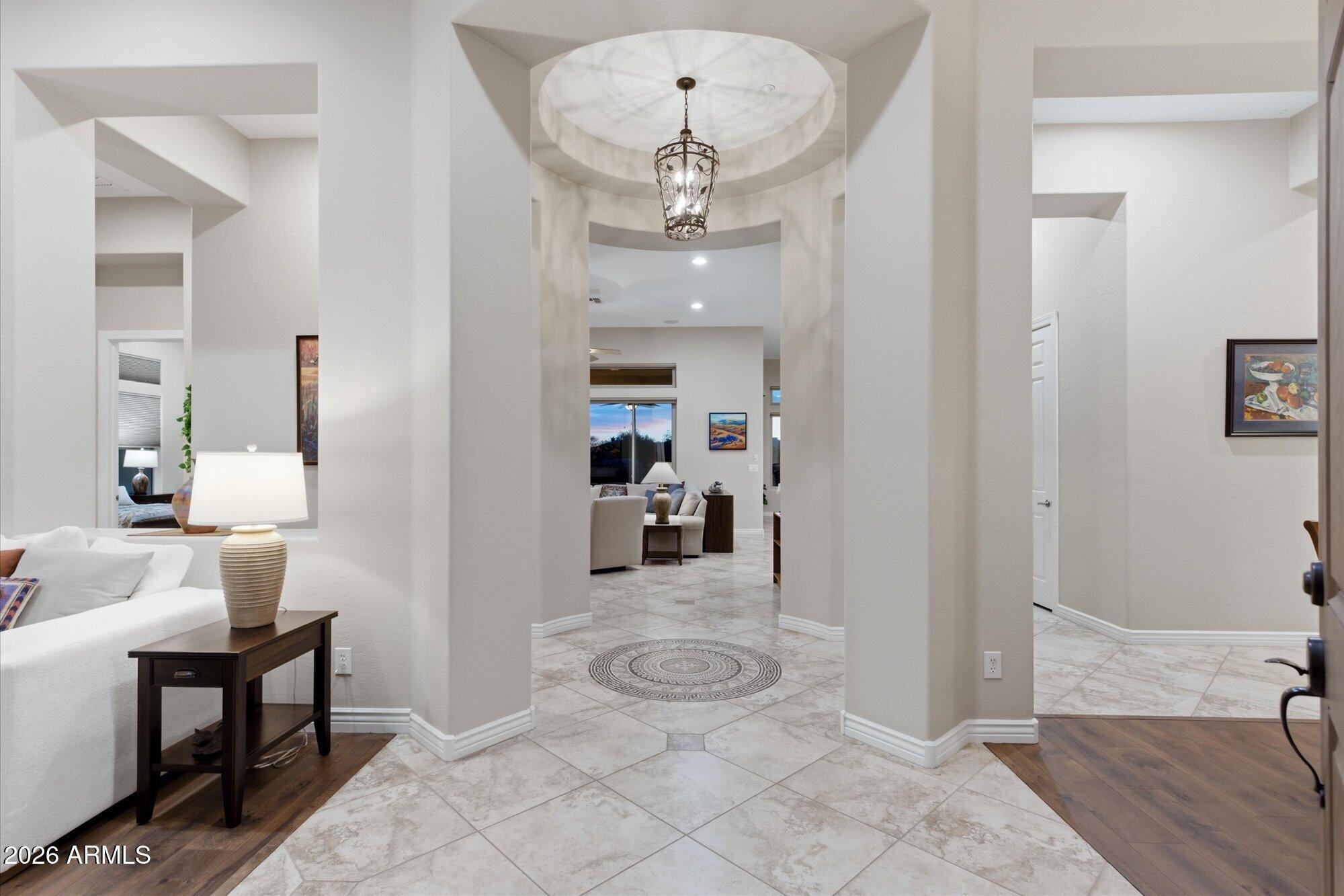40322 North Hawk Ridge Trail Anthem, AZ 85086 - Photo 8 of 63 a view of a hallway with a livingroom and dining room view