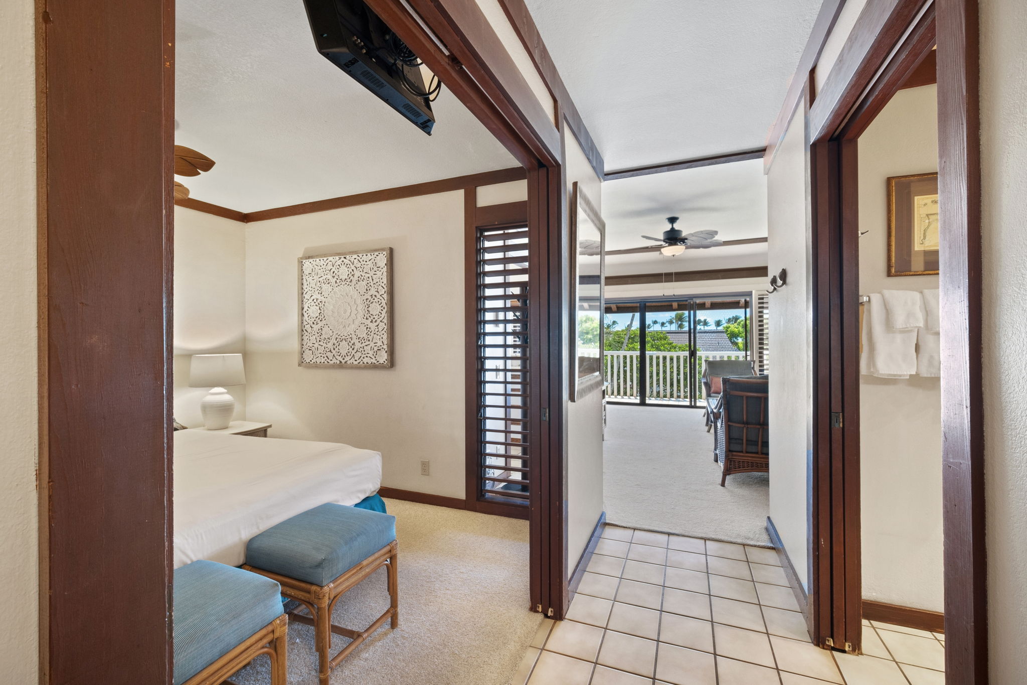2253 Poipu Road, Unit 109 Koloa, HI 96756 - Photo 11 of 30 a hallway with a dining table and chairs